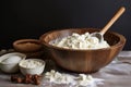 mixing dough in a ceramic bowl with wooden spoon