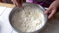 Mixing the dough in a metal bowl