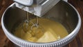 Mixing dough for sweet cake.