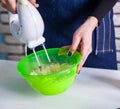 Mixing egg cream in bowl with motor mixer Royalty Free Stock Photo