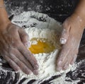 Mixing an egg with flour, dough preparation