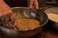 Mixing a metal bowl of different ingredients