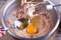 Mixing Muffin Cake Mixture For Baking. Add eggs and alcohol. Royalty Free Stock Photo