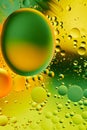 Mixing water and oil, beautiful color abstract background based on green and yellow circles, ovals, macro abstraction