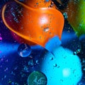 Mixing water and oil on a beautiful color abstract background gradient balls circles and ovals