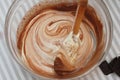 Mixing with Wooden Spoon Butter Dough in Glass Bowl. Cooking Chocolate Pie. Top view. Royalty Free Stock Photo