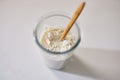 Mixing yeast dough starter ingredients in glass Royalty Free Stock Photo