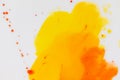 Mixing yellow and orange watercolors. Palette with autumn colors. Watercolor paints and splashes Royalty Free Stock Photo