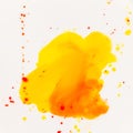 Mixing yellow and orange watercolors. Palette with autumn colors. Watercolor paints and splashes