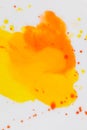 Mixing yellow and orange watercolors. Palette with autumn colors. Watercolor paints and splashes Royalty Free Stock Photo