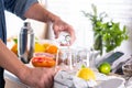 Mixologist making refreshing cocktail with hard seltzer at home Royalty Free Stock Photo