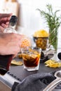 Mixologist making refreshing cocktail with vermouth at home Royalty Free Stock Photo