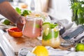 Mixologist making refreshing cocktails with hard seltzer at home