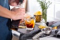 Mixologist making refreshing cocktail with vermouth at home Royalty Free Stock Photo