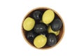 A mixture of black and green olives wooden dish