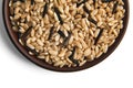 Mixture of brown and black wild rice in clay ceramic bowl close up on isolated on white background Royalty Free Stock Photo