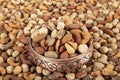 Mixture of dried fruits and nuts in a copper bowl. A mixture of peanuts, pistachios, almonds, hazelnuts and cashews Royalty Free Stock Photo