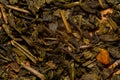 A mixture of dry green large-leaf tea with soursop. Background
