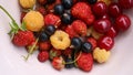 A mixture of freshly picked summer berries in a plate Royalty Free Stock Photo