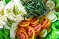 a mixture of healthy salad, vegetables, fresh cucumbers, cabbage, tomatoes, long beans or Yardlong bean, Diet menu. Top view.,. Royalty Free Stock Photo