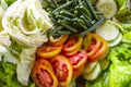 A mixture of healthy salad, vegetables, fresh cucumbers, cabbage, tomatoes, long beans or Yardlong bean, Diet menu. Top view.,. Royalty Free Stock Photo