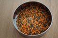 Mixture of legumes, mix of red and black lentil on wooden table. Healthy eating, vegan food Royalty Free Stock Photo