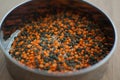 Mixture of legumes, mix of red and black lentil on wooden table. Healthy eating, vegan food Royalty Free Stock Photo