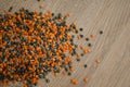 Mixture of legumes, mix of red and black lentil on wooden table. Healthy eating, vegan food Royalty Free Stock Photo