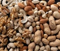 Mixture of nuts peanuts, pistachios, almonds, walnuts, hazelnut, cashew from top view with black background close up Royalty Free Stock Photo