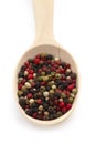 Mixture pepper in wooden spoon on white background