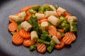 A mixture of vegetables: carrots, small heads of corn, asparagus beans steamed