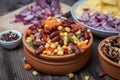 Mixture of vegetables, dried boletus mushrooms, sliced potato, red onion sliced and whole on a cutting board and spices Royalty Free Stock Photo