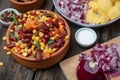 Mixture of vegetables, dried boletus mushrooms, sliced potato, red onion sliced and whole on a cutting board and spices Royalty Free Stock Photo