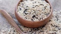 mixture of wild and white rice in a wooden bowl. Royalty Free Stock Photo