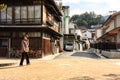 Miyajima, Japan - December 28, 2009: Elderly woman walking down the street, Miyajima Island, Japan