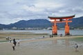 Miyajima red sacred gate on the sand in Hiroshima Japan