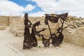 Made of metal silhouettes of the seller in the shop and the buyers in ruins of the Nabataean city Avdat, in the Judean desert in I