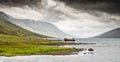 Mjoifjordur, Iceland - Panorama of fishing boat wreck rusting in Royalty Free Stock Photo