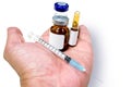 3 ml. Ampules and vial of drug with plastic syringe put in a medical needle on hand Royalty Free Stock Photo