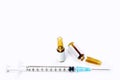 3 ml. brown ampules of drug is opened and plastic syringes with medical needle on white background