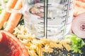 500 ml - ccm Water In A Measuring Cup Surrounded By Noodles, Pepper, Onion, Carrots And Spices Royalty Free Stock Photo