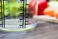 100ml / 1dl Of Water In A Measuring Cup On A Kitchen Counter With Vegetables Royalty Free Stock Photo