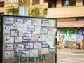 Death notices umrlice posted on a billboard in the city center of Mladenovac, indicating the recent deceased persons