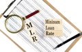 MLR - Minimum Loan Rate text on wooden block on chart background