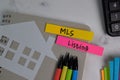 MLS Listing write on sticky notes isolated on office desk