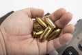 11 mm. or .45 Ammunition bullets in a man's hand Royalty Free Stock Photo