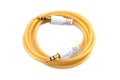 3.5 mm audio mini jack plug isolated on a white background. White audio jack with cable isolated