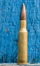 7.62mm Bullet and Wooden Background