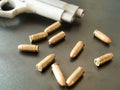 11mm bullets and short gun on black background. (selective focus). Royalty Free Stock Photo