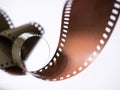 A 35mm colour roll film, curled up with shallow selective focus. Royalty Free Stock Photo
